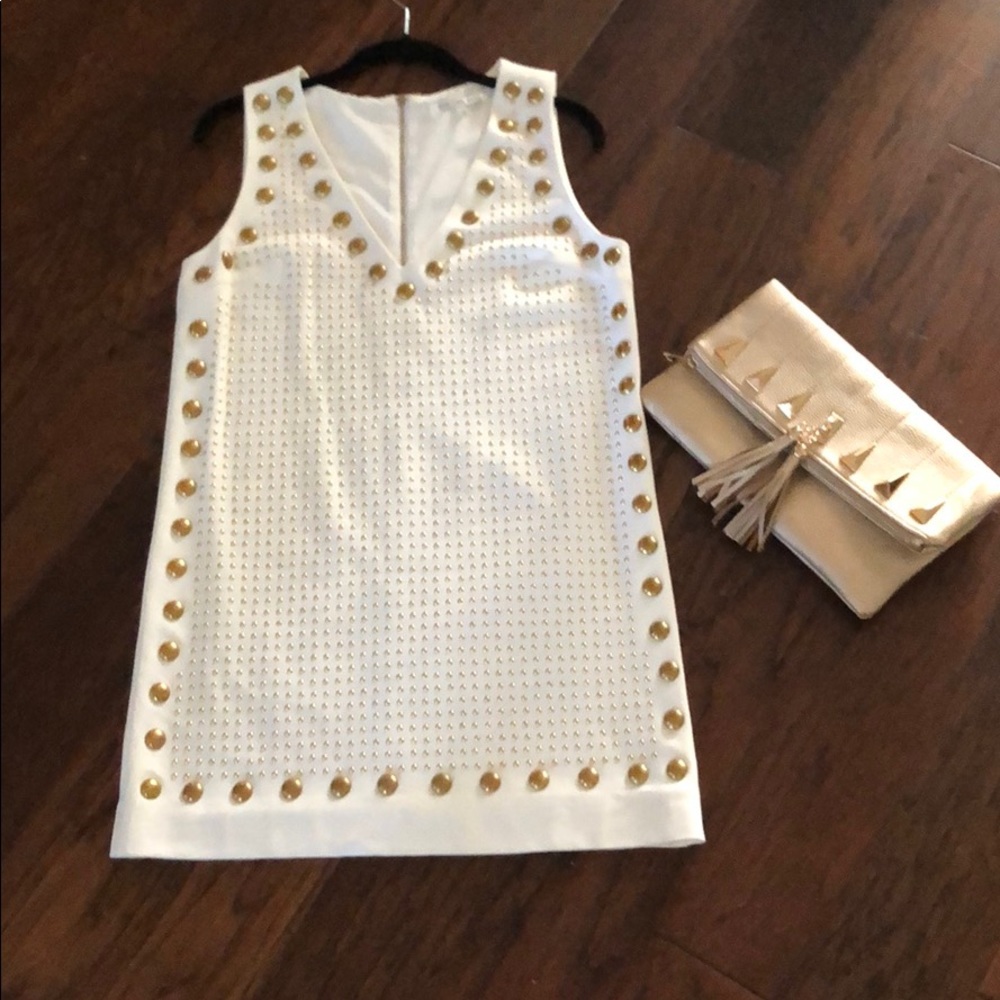 White dress with gold embellishment